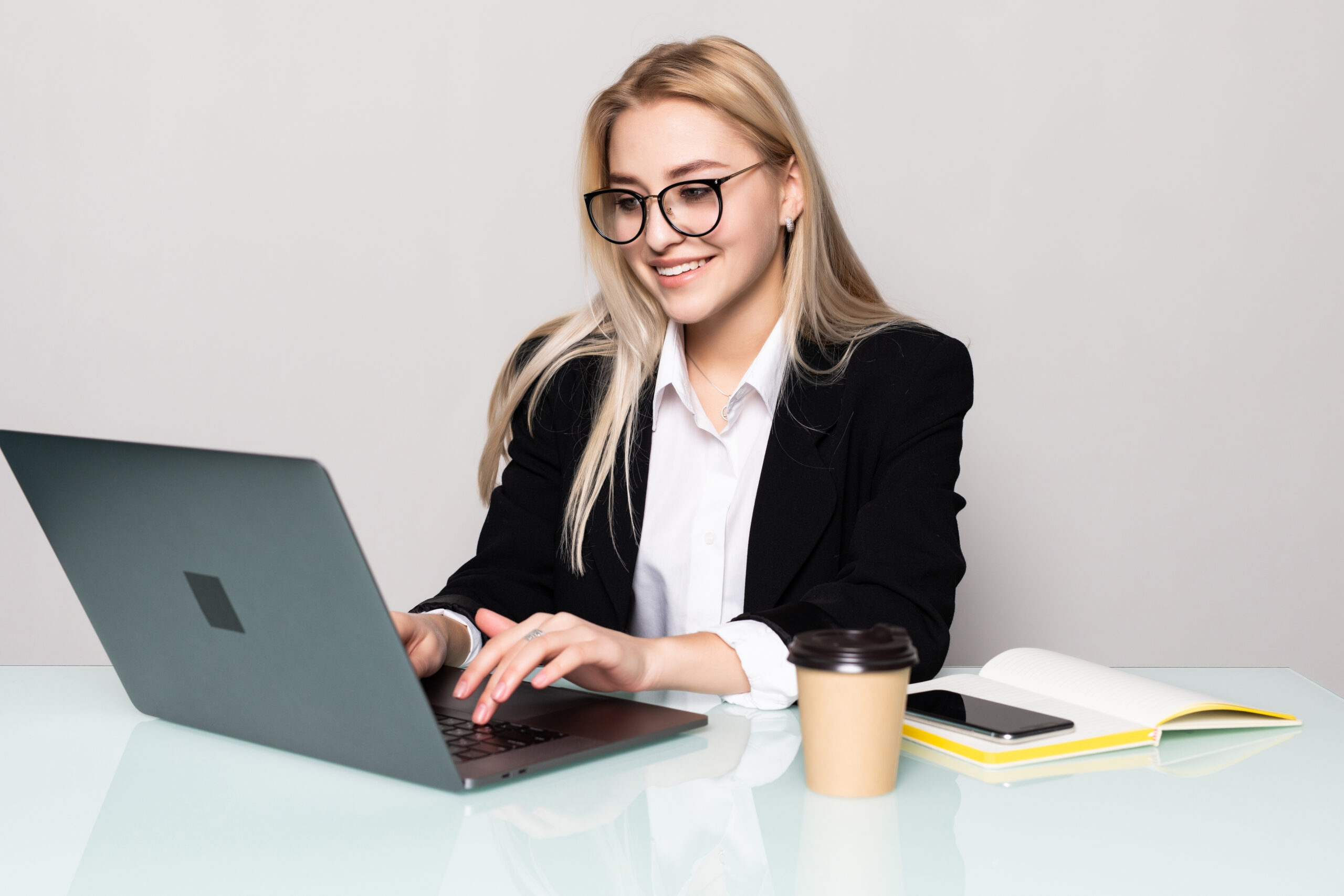 young pretty business woman with notebook isolated 1 scaled